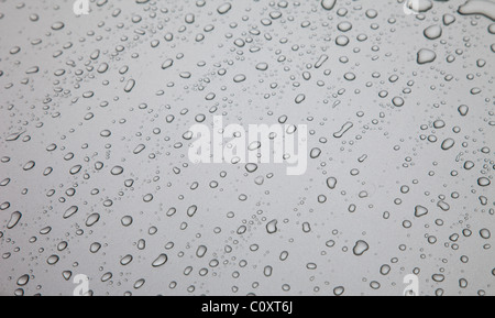 Water drops on grey silver colored metal surface Stock Photo