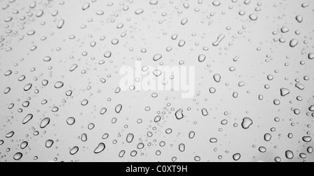 Water drops on grey silver colored metal surface Stock Photo