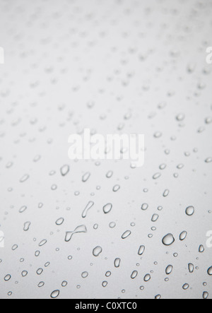Water drops on grey silver colored metal surface Stock Photo