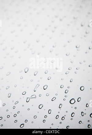 Water drops on grey silver colored metal surface Stock Photo