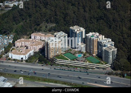 aerial view above high rise apartment buildings adjacent to interstate I-80 Albany Hill Park Albany California Stock Photo