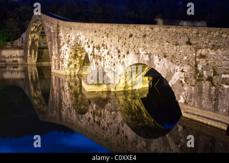 Colors and Reflections of Devils Bridge at Night, Italy Stock Photo