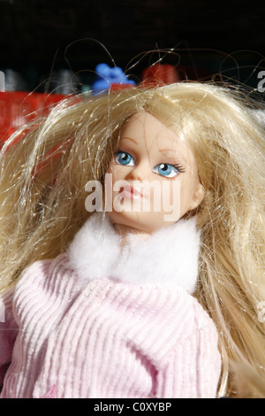 dolls in a box at jumble sale Stock Photo