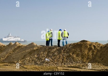 Site Managers Monitoring Beach Restoration Works Stock Photo