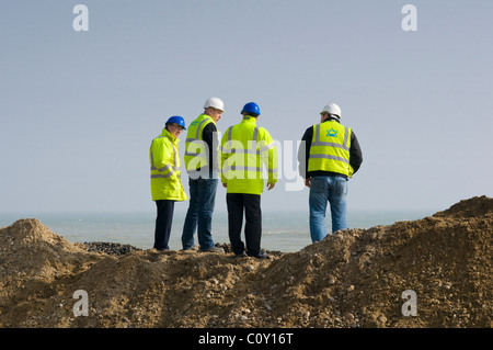 Site Managers Monitoring Beach Restoration Works Stock Photo