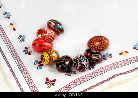 Ukrainian Easter Eggs Decorated, isolated on white, on traditional embroidery Stock Photo