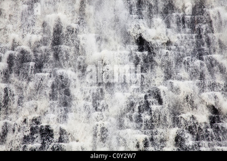 Water flowing down Howden Dam at Upper Derwent Valley Reservoir in the Peak District, Derbyshire, near Ladybower. Stock Photo