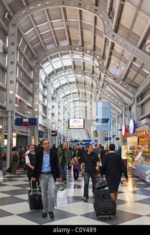 People walk through O'Hare International Airport during the holiday ...