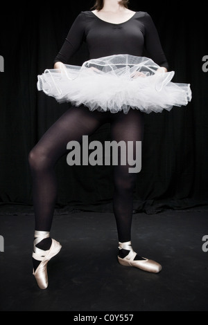 A teenage dancer wearing a black and white tutu. Stock Photo