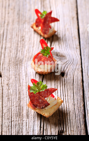 Shortcrust pastry based canapes with kielbasa - closeup Stock Photo