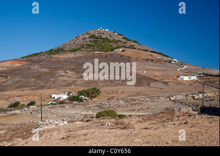Hill topped by two  small churches in the dry countryside  near Marmara, on the Greek Cyclade island of Paros. Stock Photo