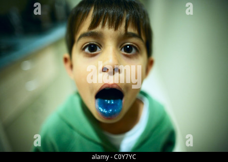 Blue tongue from blue lolly Stock Photo