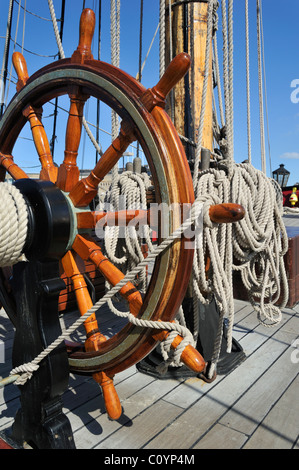 Ropes coiled around belaying pins at the Grand Turk / Etoile du Roy, frigate replica of HMS Blandford, Saint-Malo, Brittany Stock Photo