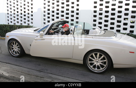 Frederic Prinz von Anhalt drives up in his new Rolls Royce drop-top Phantom and shows it off to Sylvester Stallone at the The Stock Photo