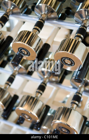 Metal weights in gym of luxury London hotel Stock Photo
