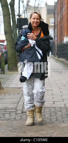 Loose Women' presenter Carol McGiffin taking her fiance's dry-cleaning to the laundrette. Carol announced live on her daytime Stock Photo