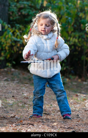 Girl playing badminton in the park