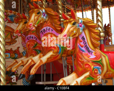 Horses on a merry-go-round Stock Photo