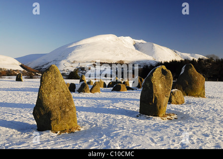 Snow covered Blencathra and Castlerigg Stone Circle in winter in the English Lake District