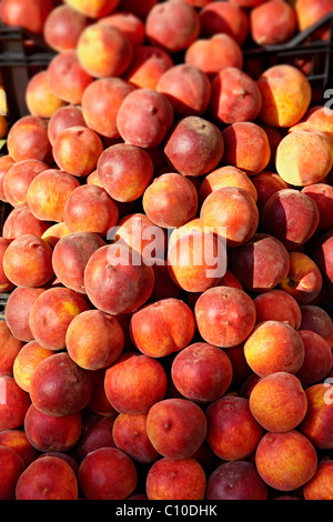 Fresh boxes of peaches outside a fruit shop, Corfu, Greek Ionian Islands Stock Photo