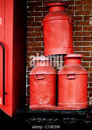 RED METAL TANK CONTAINERS  IN RAILROAD SETTING Stock Photo