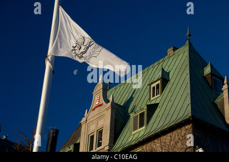 Canada, Quebec, La Malbaie. Fairmont Le Manoir Richelieu (aka Fairmont Richelieu). Fairmont flag & moon. Stock Photo