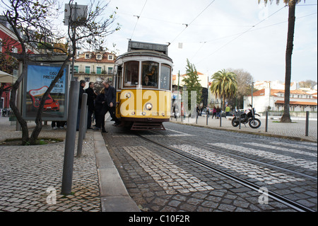 Electric tram in bus stop Stock Photo