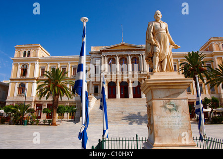 Statue of  Andreas Miaoulis, admiral of the Greek War of Independence, and the Neo Classic City Hall of Ermoupolis, Syros Stock Photo