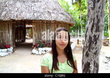Indian girl in jungle palapa hut house rainforest Latin America Stock Photo