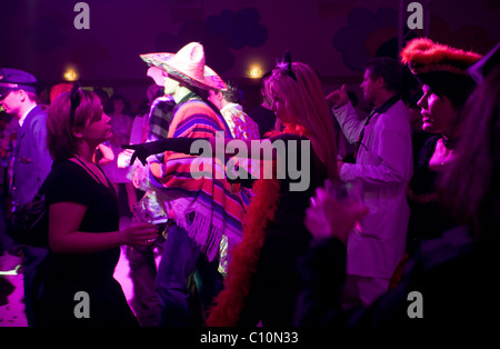People dancing enjoying nightlife during the Crazy Days of the Carnival in Cologne (Germany) Stock Photo