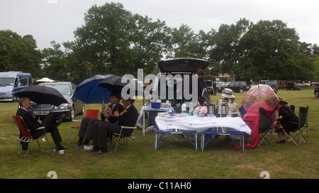 Race goers enjoy a picnic in a car park at Royal Ascot. Stock Photo