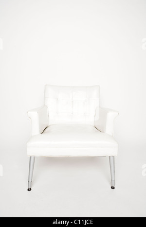 A white chair against a white background. Stock Photo
