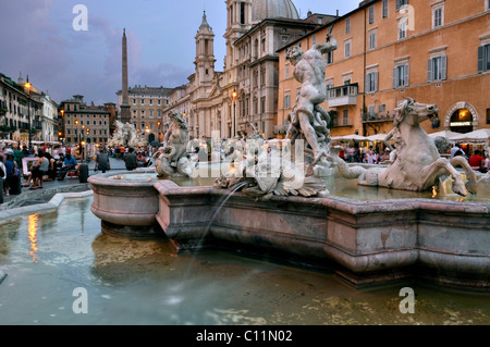 Fontana del Nettuno Fountain of Neptune and Sant'Agnese in Agone basilica church, Piazza Navona square, Rome, Lazio, Italy Stock Photo