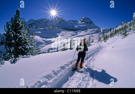 Snowshoe walker on the Grossfanes Alm mountain pasture, Alta Badia, South Tyrol, Dolomites mountains, Italy, Europe Stock Photo