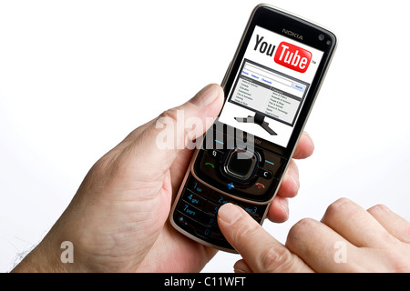 Using YouTube on a mobile phone Stock Photo