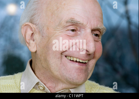 Elderly man having a conversation, smiling, Germany, Europe Stock Photo