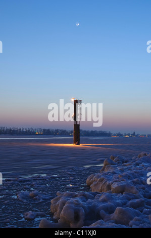 Illuminated beacon on the wintery river Elbe near Hamburg, Germany, Europe Stock Photo