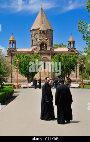 Armenian orthodox priest, monk with main cathedral at Echmiadzin, UNESCO World Heritage Site, Armenia, Asia Stock Photo