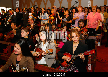 Women making music, worship service, Catedral Evangelica de Chile, Pentecostal Church, Santiago de Chile, Chile, South America Stock Photo