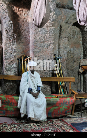 Interior of an ethiopian orthodox church with sitting priest in Lalibela, Amhara, Ethiopia, Africa Stock Photo