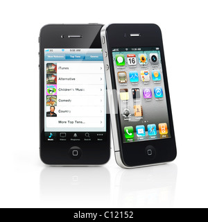 Two Apple iPhone 4 smartphones one leaning against another isolated on white background. High quality photo. Stock Photo