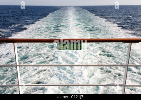 Emergency exit sign on the railing of a cruise ship Stock Photo