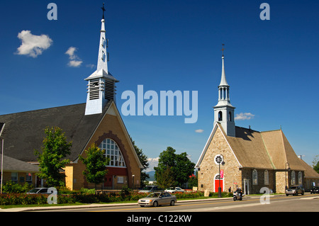 New church, left, and Saint-Pierre-et-Saint-Paul Church, historic monument in the town of St-Pierre-de-l'Ile-d'Orleans on Stock Photo