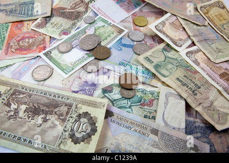 Banknotes and coins from different currencies Stock Photo