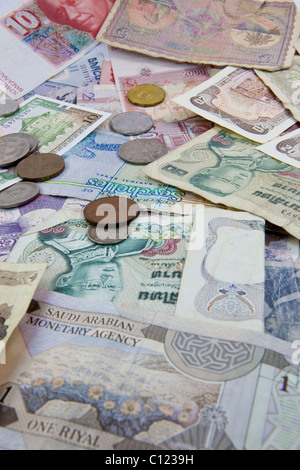 Banknotes and coins from different currencies Stock Photo