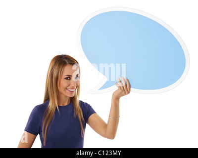 mid adult woman holding blank speech bubble on white background. Stock Photo