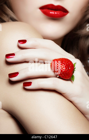 Young woman with a strawberry ring, jewelry Stock Photo