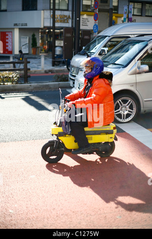 Japanese man on a mini-motorcycle, Tokyo, Japan, Asia Stock Photo