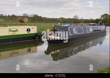 Two canal boats on the Leeds-Liverpool Canal near Skipton, North Yorkshire. Stock Photo