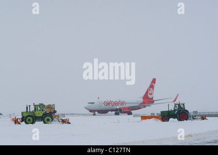 Snow, winter, snow removal with tractors, Air Berlin Boeing 737 aircraft, taxiway, Munich Airport, MUC, Bavaria, Germany, Europe Stock Photo